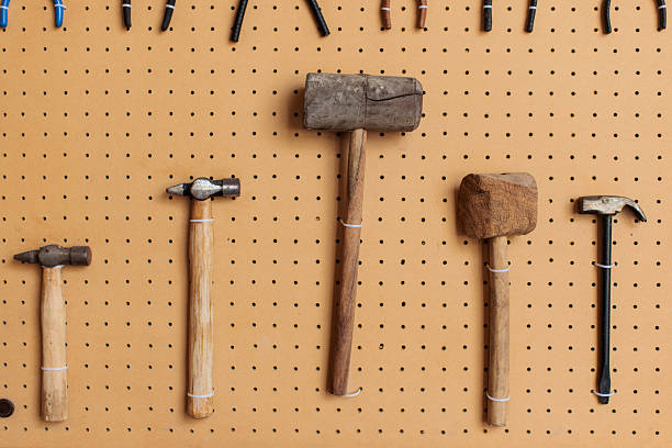 istock Variety of Hammers Hanging on Pegboard in Workshop 2223696601