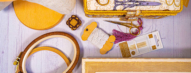istock Accessories for hobby. Hoop snaps, scissors, threads, needles and scissors. Vintage tools for embroidery and knitting 2223696911