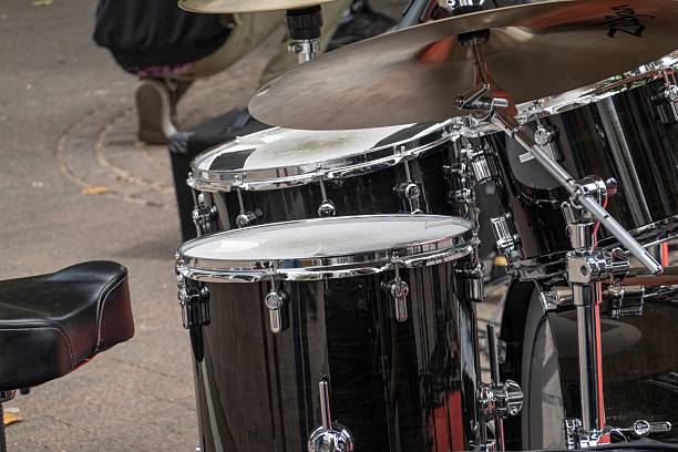 Black drum kit ready for a street concert, waiting for the drummer