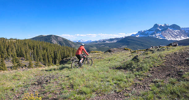 istock Young man mountain bikes trail on mountain top 2223701243