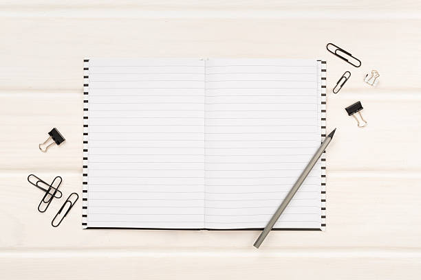 istock Notebook with stationary on wooden background, top view 2223701521