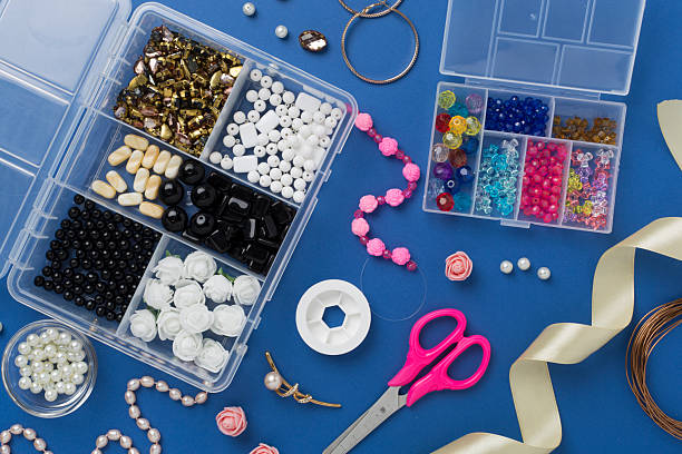 istock Tools and beads for making handmade jewelry on color background, top view 2223706725