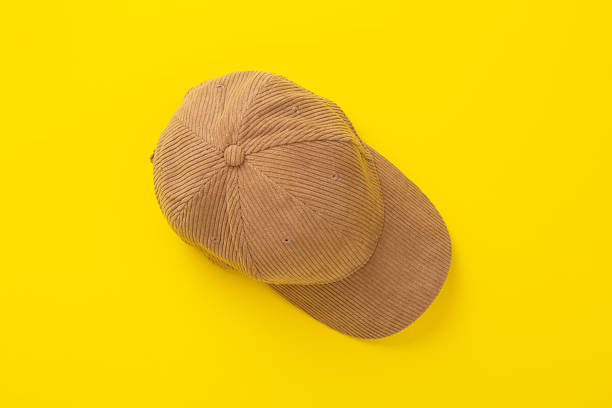 istock Beige velvet cap on color background, top view 2223706732