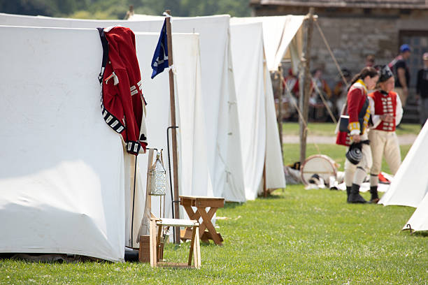 A reenactment scene from 1779 showing a colonial soldier's red coat draped over his tent at the Revolutionary War Encampment at Fort Niagara in New York.