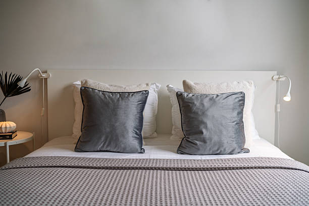 istock Modern Double Bed with Decorative Pillows in Elegant Bedroom Interior 2223716886
