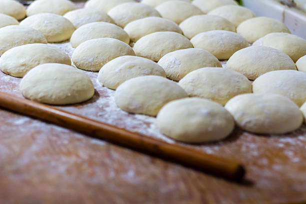 istock Homemade dough on wooden table at home. 2223725847