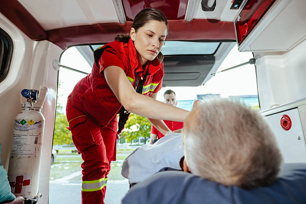 istock Paramedic assisting a patient on a stretcher inside an ambulance 2223726735