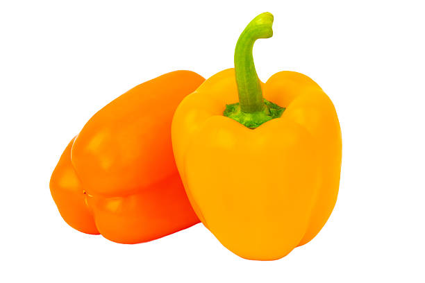 istock Yellow and orange bell peppers isolated on white background, front view 2223728216