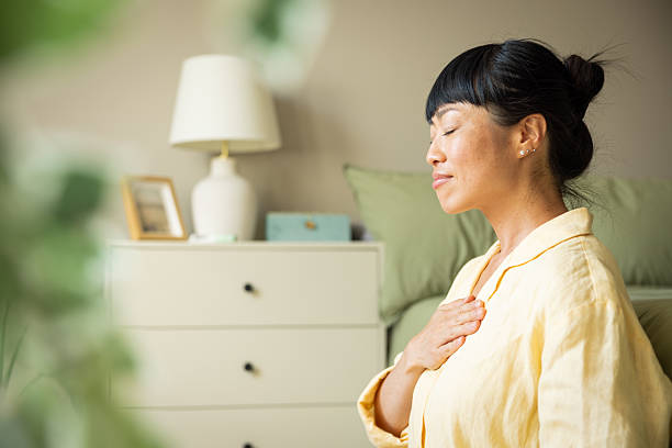 istock Japanese woman meditating during morning 2223728848