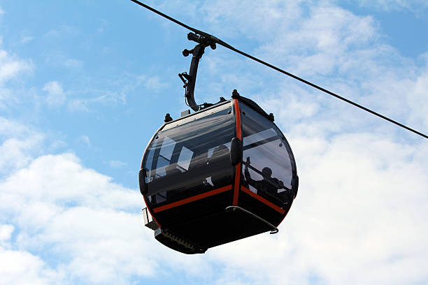 istock Modern cable car gondola suspended against blue sky 2223730350