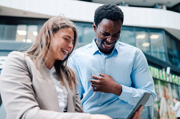 istock Business colleagues sharing a hilarious moment on tablet 2223733364
