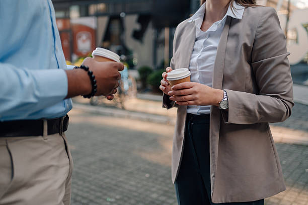 istock Business partners having a coffee break outdoors during a work day 2223733458