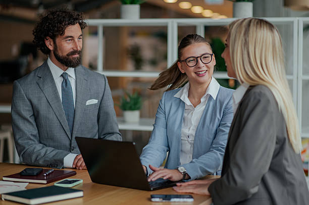 istock Business team working together on laptop in modern office 2223733681