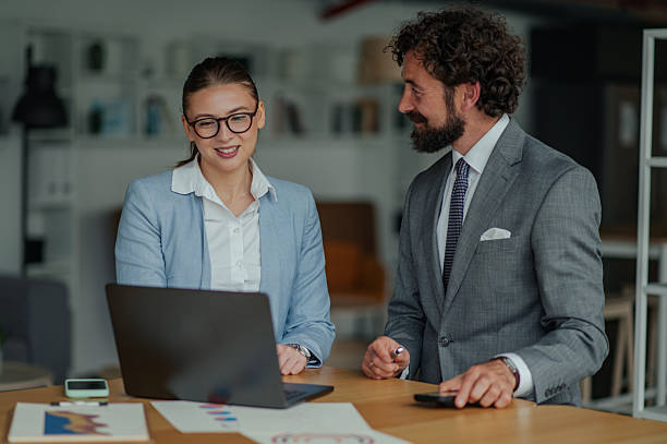 istock Business colleagues collaborating on laptop in office 2223733701