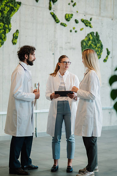 istock Doctors discussing patient information using tablet in modern hospital 2223733894
