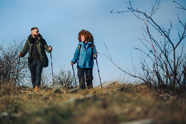 istock Hikers walking up mountain trail on sunny day 2223734265