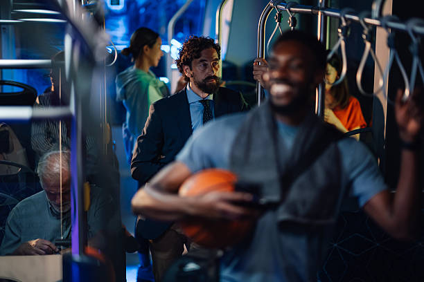 istock Diverse passengers riding a modern bus at night 2223734398