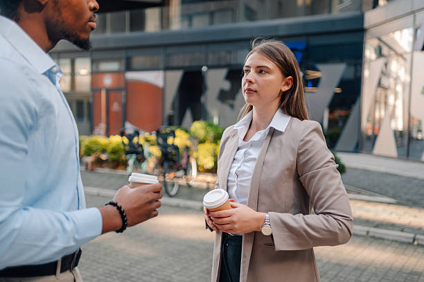 istock Business colleagues enjoying a coffee break outside the office 2223734669
