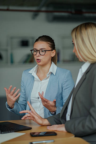 istock Businesswomen having a conversation at work 2223734774