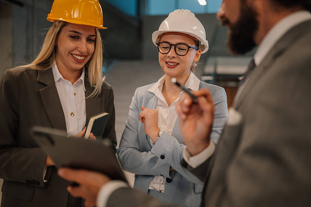 istock Engineers and manager discussing a project in a factory 2223735098