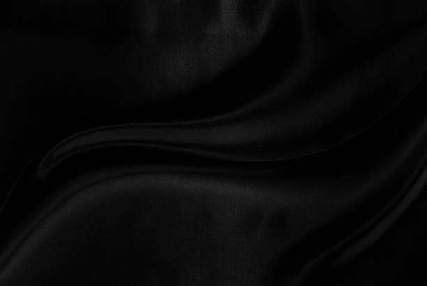 istock Black gray satin dark fabric texture luxurious shiny that is abstract silk cloth background with patterns soft waves blur beautiful. 2223739178