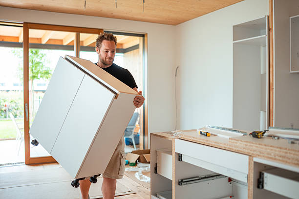 istock Man Installs Cabinetry in Home Kitchen 2223741910