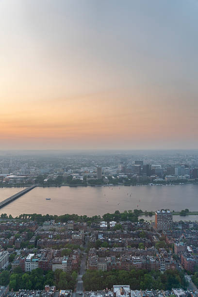 istock Boston cityscape at sunset with river and buildings 2223742234