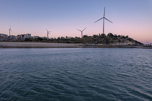 Beach and wind turbines by the seaside