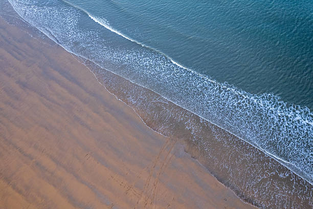 istock Overlooking the golden beach and waves 2223747984
