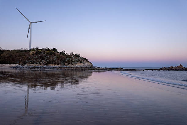 istock Beach and wind turbines by the seaside 2223747990
