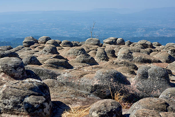 Scenic landscape of unique knob-like rock formations on a mountain top. A concept for geology, nature, travel in Thailand, and amazing natural wonders.