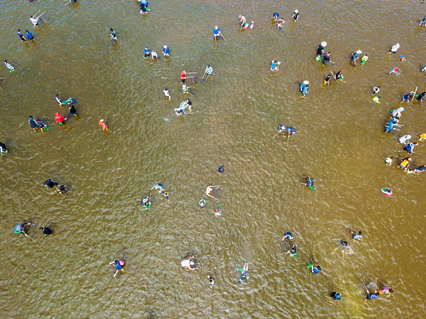 istock people catching fish in the river 2223756617