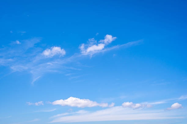 istock White fluffy clouds with the beautiful blue sky 2223757851