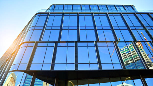istock Modern office building with glass facade on a clear sky background. 2223758982