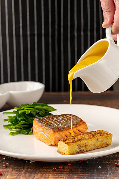istock Seared salmon fillet served with wilted spinach and potato croquette 2223760170