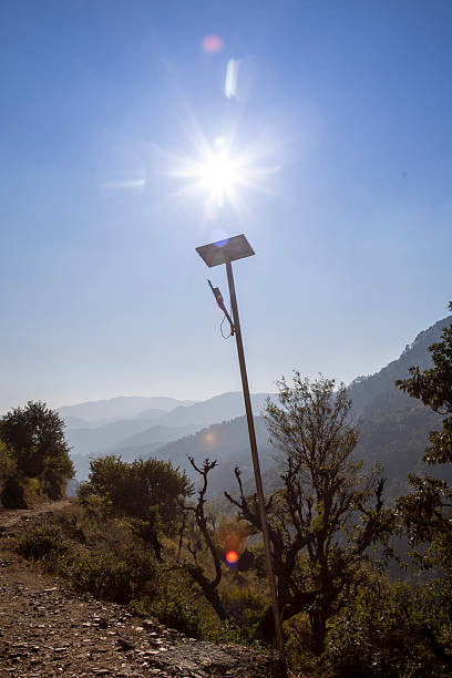 istock Sunlit Solar Panel Facing Mountain View in Indian Village Landscape 2223760425