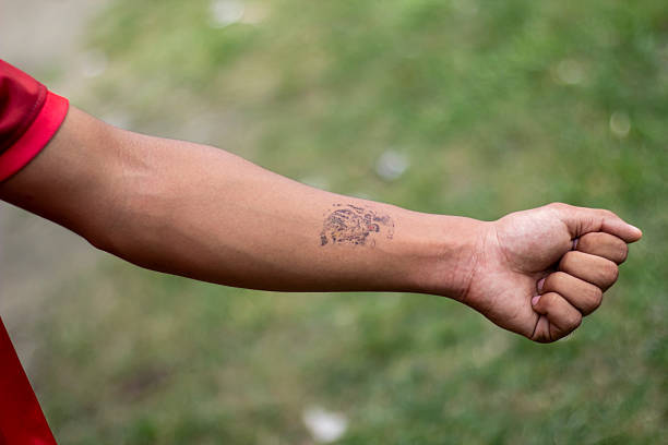 istock A young man shows his hand tattoo 2223762331