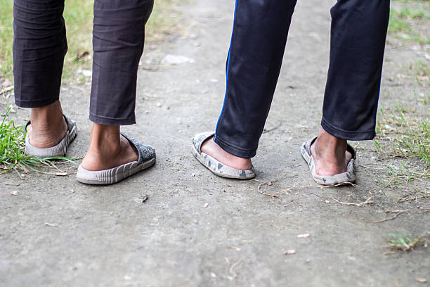 istock Three people standing together on the ground in the street 2223762437