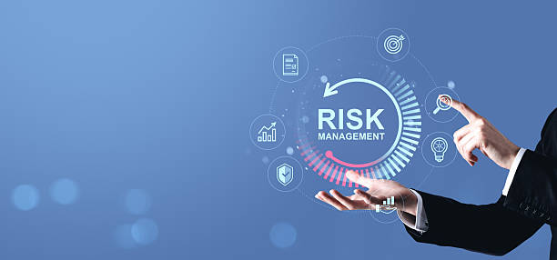 istock Businessman interacting with risk management interface showing icons for analysis, protection, and investment on a blue digital background. 2223762943
