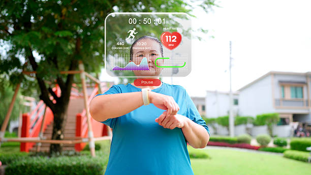 A woman running on a treadmill checks her smartwatch, which projects an augmented reality (AR) display showing real-time fitness data like heart rate, distance, and calories