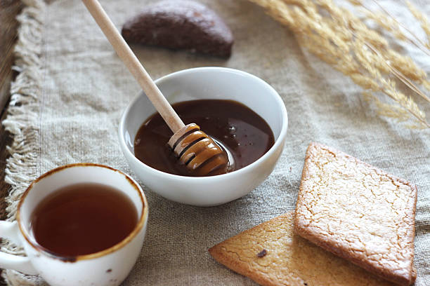 istock Honey, tea and cookies on the table 2223763801