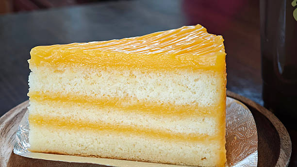 Orange cake on a wooden plate