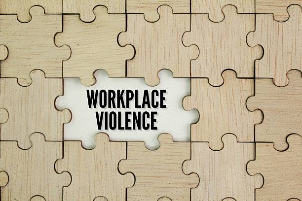 istock Wooden puzzle with WORKPLACE VIOLENCE. physical violence, harassment, intimidation, or other threatening disruptive behavior. 2223770092