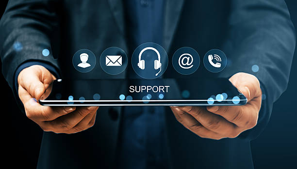 istock Businessman holding digital tablet with virtual support icons representing online customer service and communication solutions interface. 2223770938