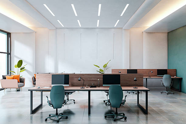 istock Modern empty office interior with minimalist design, sleek desks, computers, and stylish chairs in spacious contemporary workspace setting. 3D Rendering 2223771033