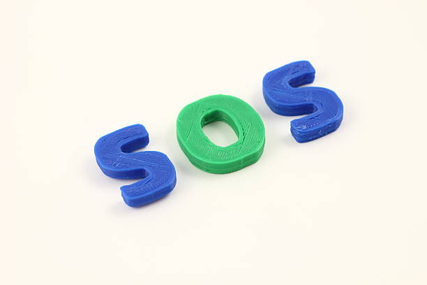 The three-dimensionally arranged blue and green SOS letters clearly convey a message seeking rescue or assistance. This image offers high visibility on a simple background.