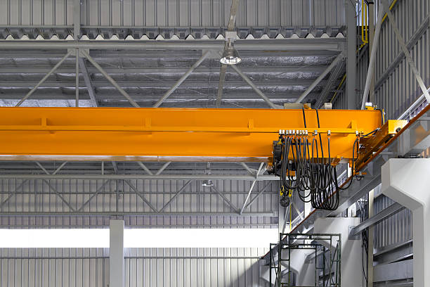 istock Overhead crane or lifting equipment inside factory or warehouse. 2223775388