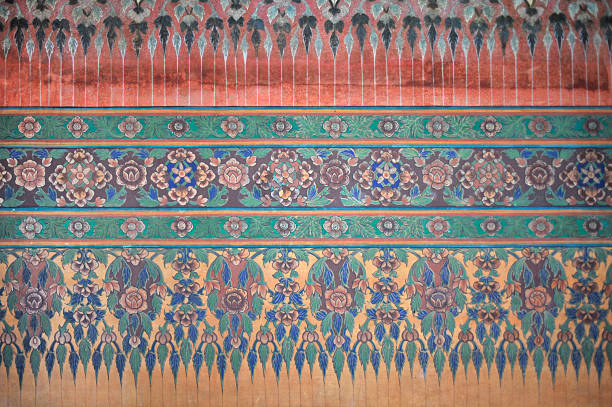 Tumpat Kelantan January 2013 in winter the Buddhist temple Wat Machimmaram in Tumpat is visited by both believers and tourists to admire the great sitting Buddha 30 meters tall and the beautiful and ancient wall decoration representing the Buddhist deities