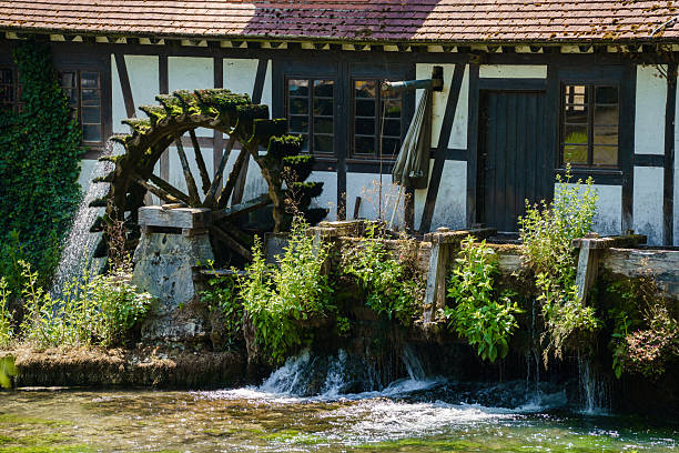 German watermill at the Blautopf lake, Blaubeuren village, Baden-Wuerttemberg, southern Germany. Black forest travel destinations