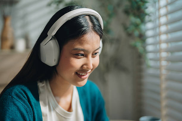 istock Woman enjoying her online class, attentively taking notes as she stays engaged and focused 2223779934
